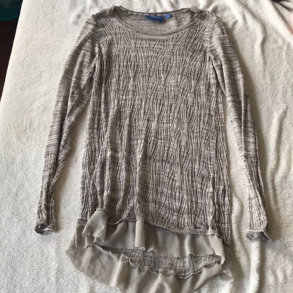 Long sleeve sweater with fabric around bottom